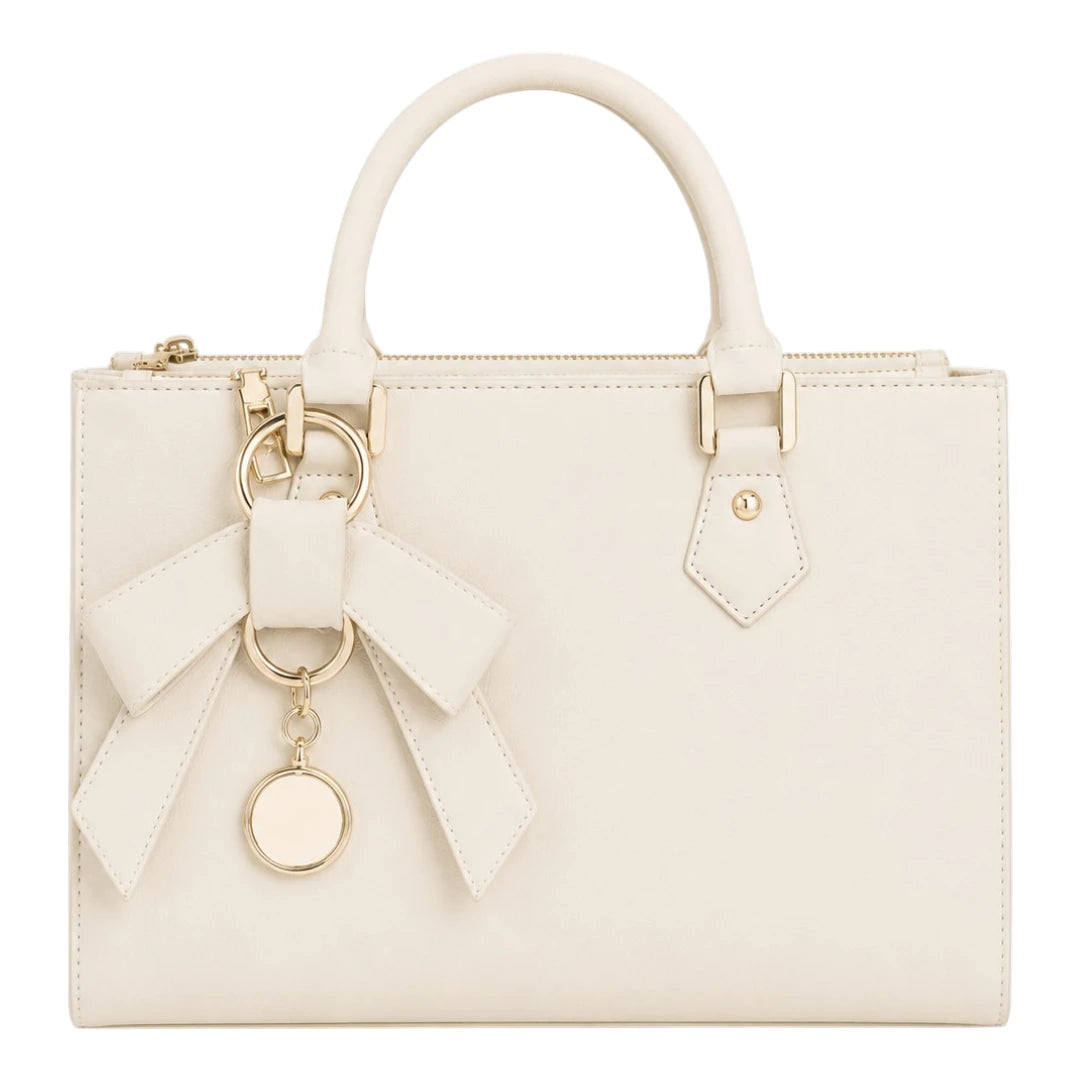 The Perfect Purse LLC Women's Elegant Ivory Leather Handbag with Decorative Bow Charm